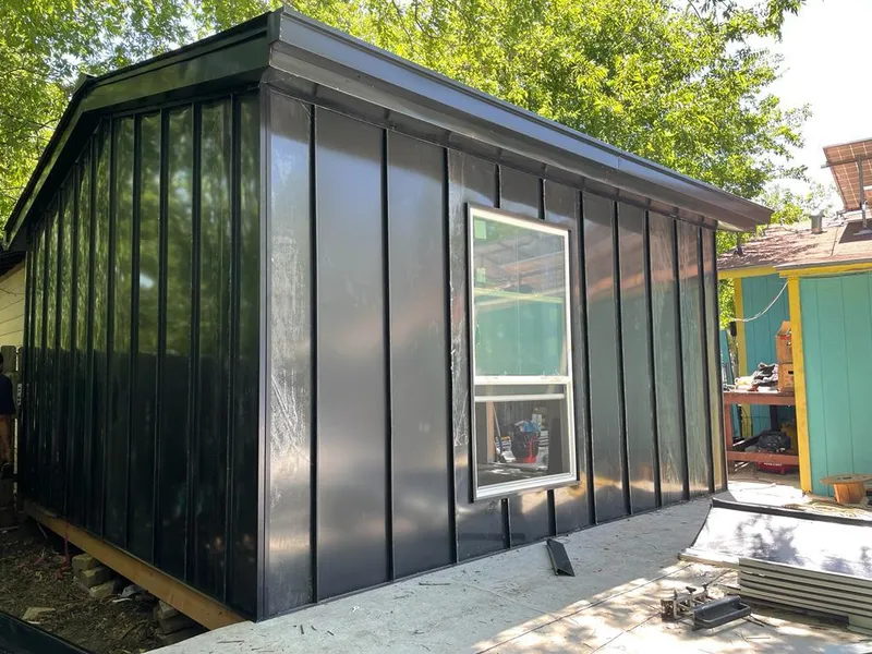 Black standing seam metal wall panels for Metal Roof Installation in Forest Park