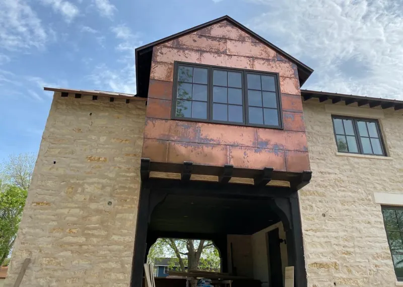 Copper metal panel facade on a stone building for Metal Roof Coating in Forest Park